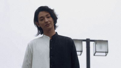Long-Haired Man In Black And White Shirt GIF
