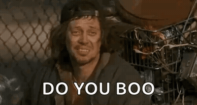 Long Haired Man In Hat In Trash Can Asks Do You Boo GIF