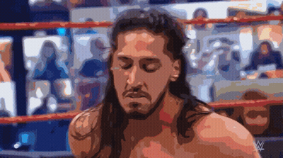 Long-Haired Man In Wrestling Ring With W On Chest GIF