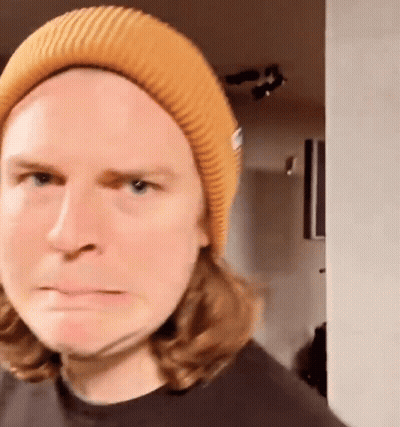 Long Haired Man In Yellow Beanie Funny Face GIF
