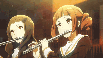 Long-Haired Man Playing Flute Dark Room GIF