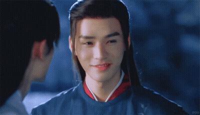 Long-Haired Man Smiling At Another Man GIF