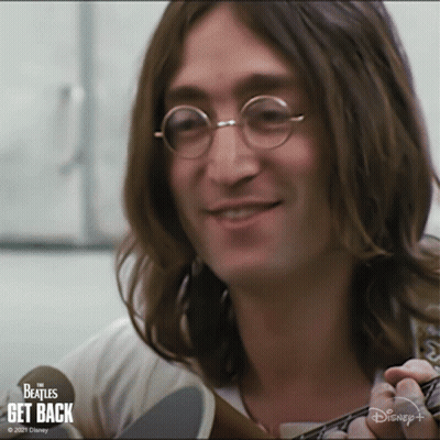 Long Haired Man Smiling Holding Guitar Disney+ Logo GIF