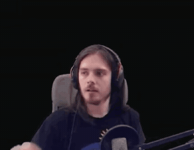 Long-Haired Man With Headphones Making Heart At Microphone GIF