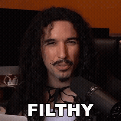 Long Haired Man With Mustache Says Filthy At Microphone GIF
