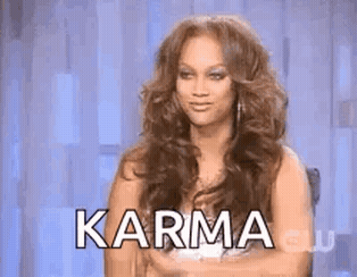 Long Haired Woman Arms Crossed In Chair Karma GIF