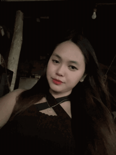 Long-Haired Woman In Black Top And Necklace GIF