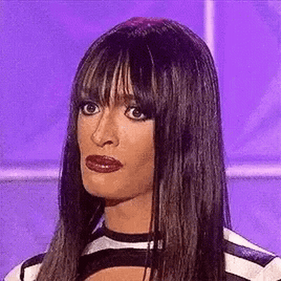 Long-Haired Woman In Striped Shirt Making Funny Face GIF