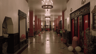 Long Hallway With Balloons And Chandelier GIF