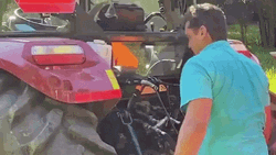Looking At Tractor's Engine GIF