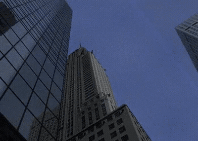 Looking Up At A Tall Building With A Sign That Says ' Chicago ' GIF