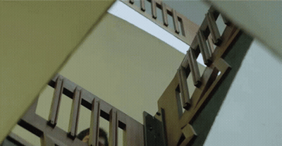 Looking Up At Wooden Staircase With Missing Steps GIF