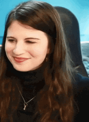 Lovely Lady In Black Gestures Heart Hands GIF