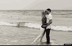 Lovers Passionate Kissing At The Beach