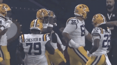 LSU Football Players In A Huddle GIF