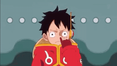 Luffy From One Piece Is Reading A Book While Holding A Stick In His Mouth . GIF