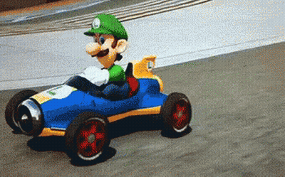 Luigi Driving Toy Car On Race Track GIF