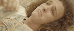 Lying On Money While Crying GIF