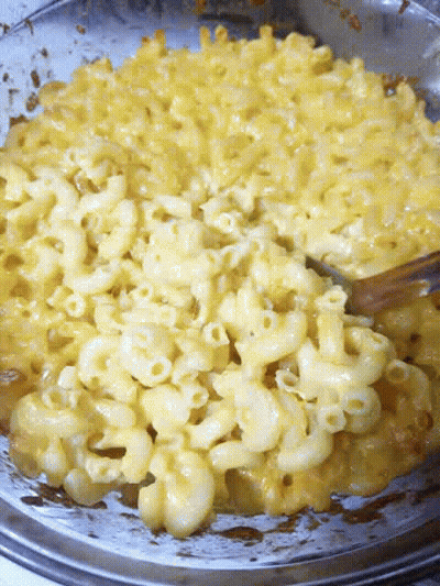 Macaroni And Cheese In A Bowl With A Fork In It GIF
