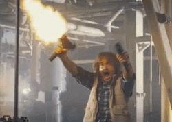 Macgruber Holding Gun While Shooting GIF