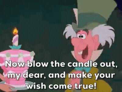 Mad Hatter Blowing Out Candle On Pink Cake GIF
