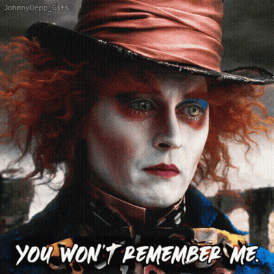 Mad Hatter Blowing Out Candle On Pink Cake GIF
