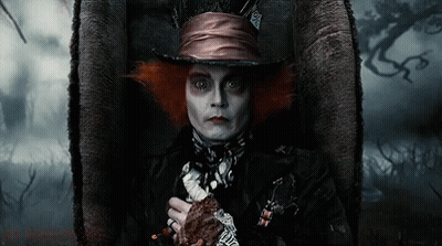 Mad Hatter Costume Man Sitting With Sword GIF
