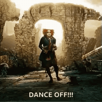 Mad Hatter Dancing In Front Of Brick Wall GIF