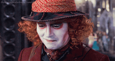 Mad Hatter From Alice In Wonderland Wearing Hat And Scarf GIF