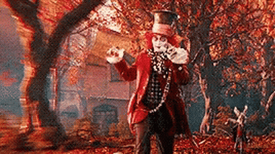 Mad Hatter Holding Teapot In Forest GIF