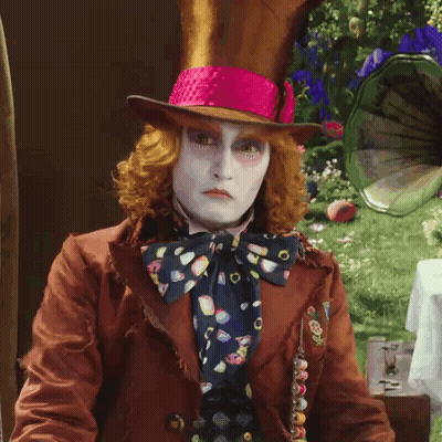 Mad Hatter In Brown Jacket And Pink Hat GIF