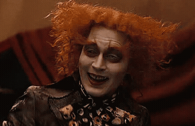 Mad Hatter Smiling In Leopard Print Jacket GIF