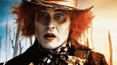 Mad Hatter Wearing Hat And Scarf GIF