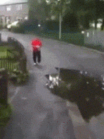 Mad Man Walking On Wet Road GIF