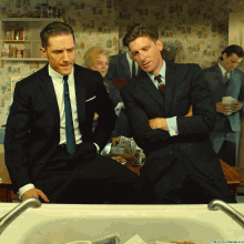 Mafia Putting Money Bags On Sink GIF