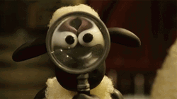 Magnifying Glass Over Puppet Sheep Face GIF