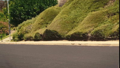 Mailbox On Road Next To Hill GIF
