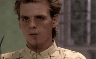 Man Adjusting Glasses With Word Nostalgia GIF