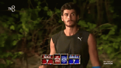 Man Adjusting Hair In Front Of Survivor TV GIF