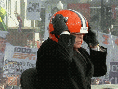 Man Adjusting Helmet In Front Of Cam Newton Sign GIF