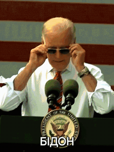 Man Adjusting Sunglasses In Front Of Presidential Seal GIF