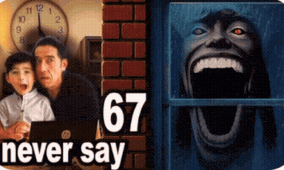 Man And Boy Beside Clock With 67 Above GIF