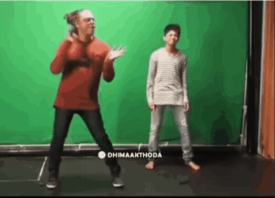 Man And Boy Dancing In Front Of Dhimaakthode Green Screen GIF