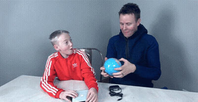 Man And Boy Holding Blue Ball Boy In Adidas Jacket GIF