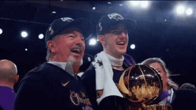 Man And Boy Holding Trophy With Champions Hats GIF