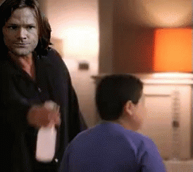 Man And Boy In Blue Shirt With Milk Bottle GIF