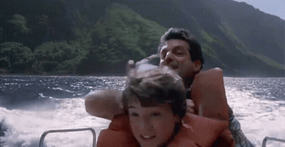 Man And Boy Riding Boat In Ocean GIF