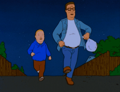 Man And Boy Running Down Street At Night GIF