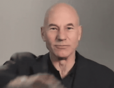 Man And Boy Scout In Front Of Movie Tent Sign GIF