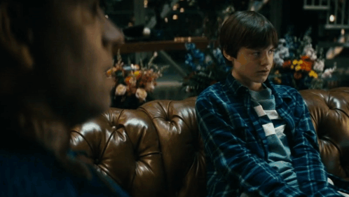 Man And Boy Sitting On Couch GIF